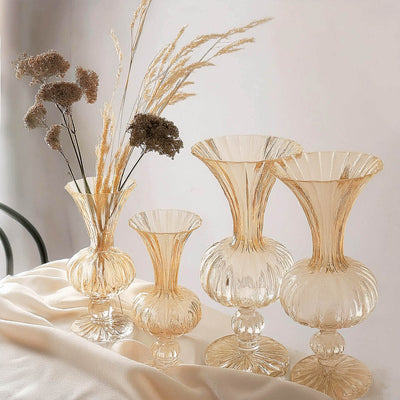 Elegant glass vases in various sizes with dried flowers