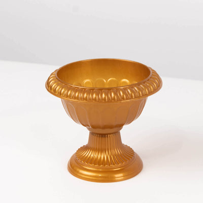 Gold decorative bowl on a plain background.