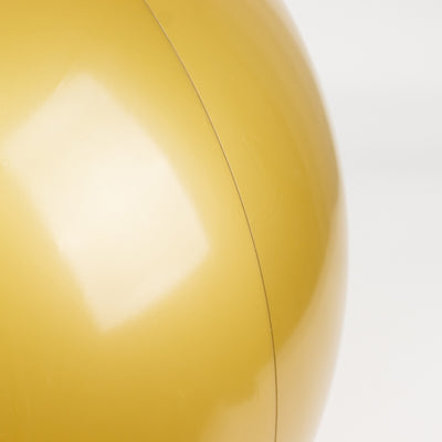 Yellow exercise ball with a smooth surface and glossy finish.