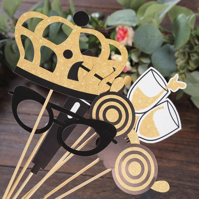 Party photo booth props including crown, glasses, and champagne glasses.