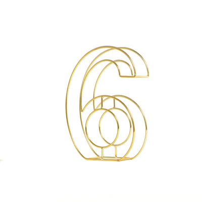 Gold wire number 6 decorative piece on white background
