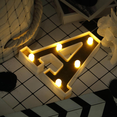 Illuminated letter A marquee light on a stylish background.
