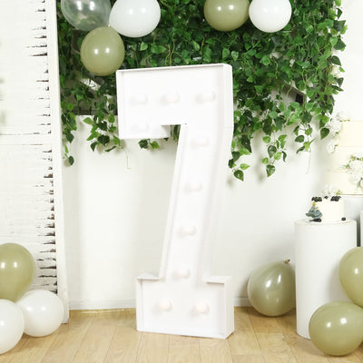 Large white marquee number 7 with bulbs, perfect for celebrations and events.