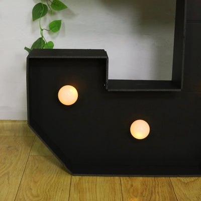 Black geometric shelf with two round warm LED lights