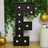Light-up marquee letter E with bulbs, surrounded by greenery and balloons.