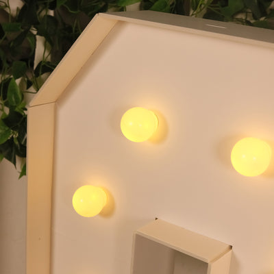 Decorative house-shaped light with four yellow bulbs