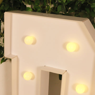 Light-up marquee letter with yellow bulbs, perfect for events and decor.