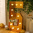 Gold marquee number 5 with lights, ideal for parties and celebrations.
