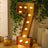 Gold number 7 marquee sign with lights, perfect for celebrations and events.