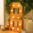 Decorative mirrored number 8 with lights in a festive setting.