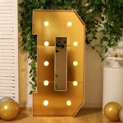 Gold marquee number "0" with lights, perfect for celebrations and events.