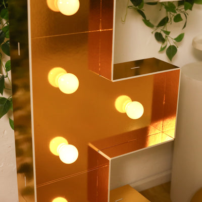 Gold marquee letter with lights for decoration.