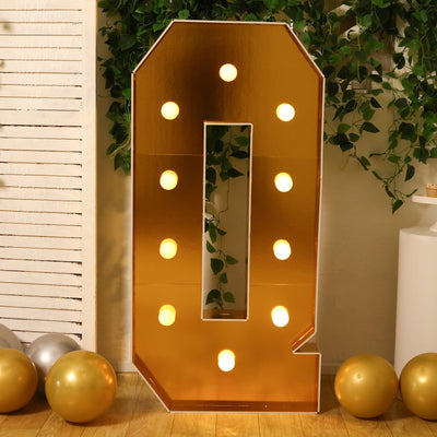 Gold marquee number 0 with lights, perfect for celebrations and events.