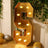 Gold marquee letter "S" with lights, perfect for events and decor.