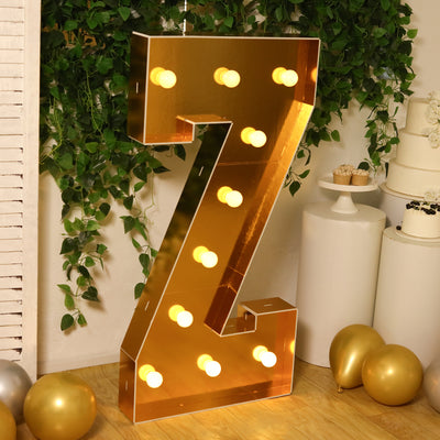 Gold marquee letter Z with lights, perfect for events and celebrations.