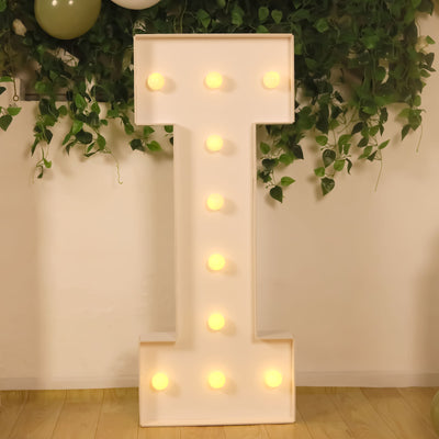 Illuminated marquee letter "I" with bulbs, perfect for events or decorations.