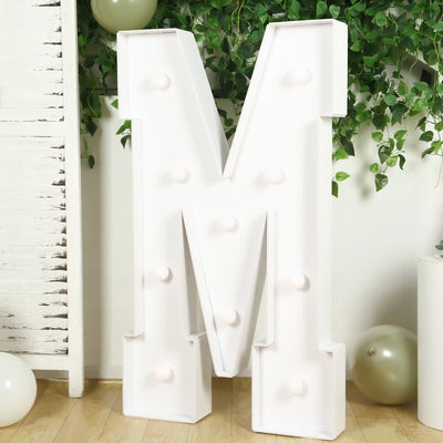 Large decorative letter "M" with lights, perfect for events or home decor.