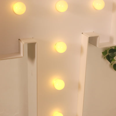 Decorative yellow wall lights in a modern interior setting.