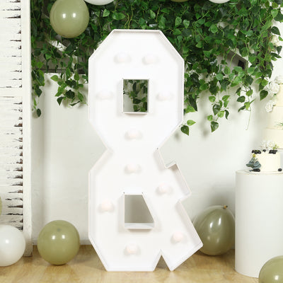 Large decorative light-up number 8 in a festive setting.