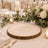 Elegant wedding table setting with rustic wood slice charger and white floral centerpiece
