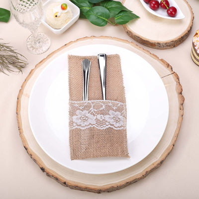 Rustic burlap cutlery holder with lace on a plate