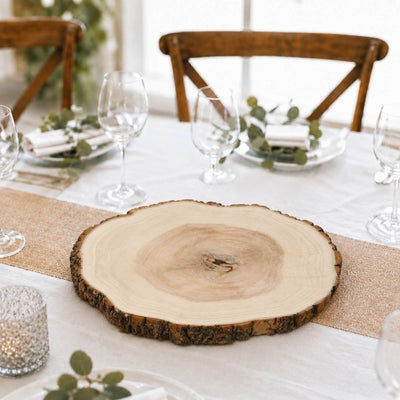 Rustic wood slice centerpiece on elegant dining table setting