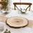 Rustic wood slice centerpiece on elegant dining table setting