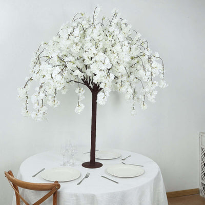 Artificial white cherry blossom tree centerpiece for dining table decor.