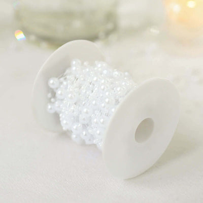White pearl beading on a spool for crafting projects.