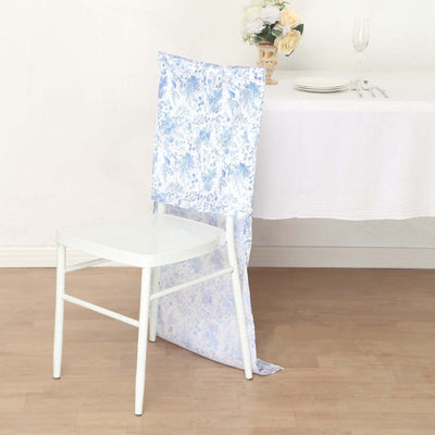Chair with blue floral fabric cover styled at a dining table.