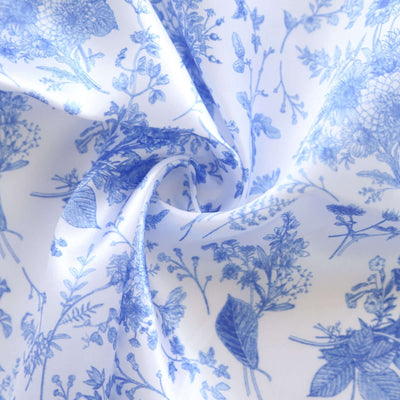 Blue floral patterned fabric in a twisting arrangement.