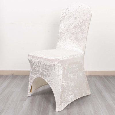 White velvet chair cover on a plain backdrop.