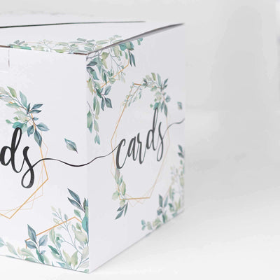 Decorative card box with floral design and elegant typography on a white background.