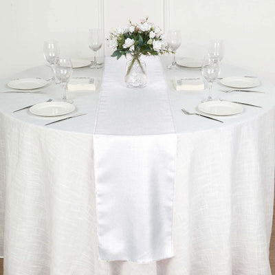 Elegant dining table setting with a floral centerpiece and place settings.