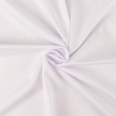 White fabric close-up showcasing smooth texture and subtle sheen.