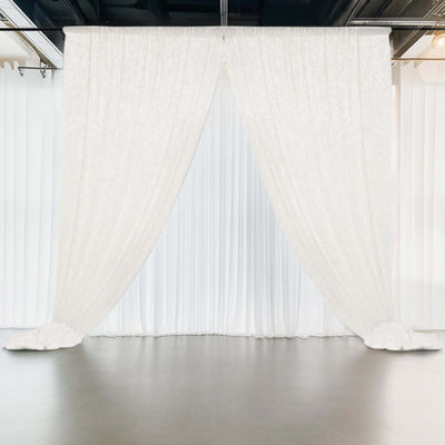 White drapery curtains in a studio setting, creating a soft backdrop.