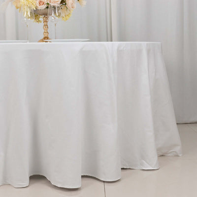 White tablecloth draping elegantly over a table in a staged setting.