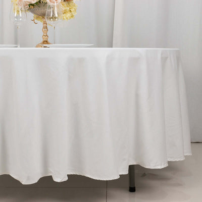 White tablecloth draping elegantly over a table with decorative elements.