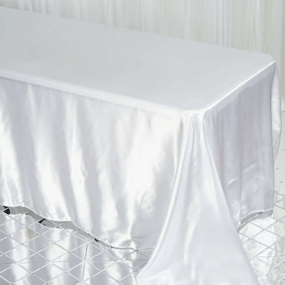 White satin tablecloth draped elegantly over a table.