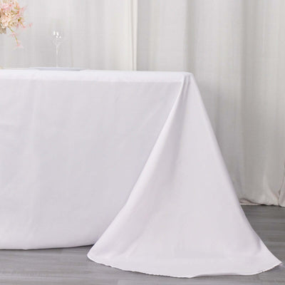 White tablecloth draped elegantly over a table, perfect for events or dining.