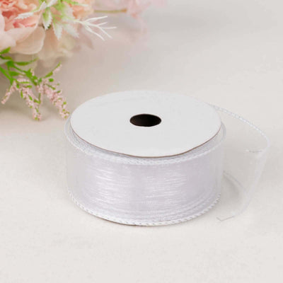 White satin ribbon spool with a delicate sheen.