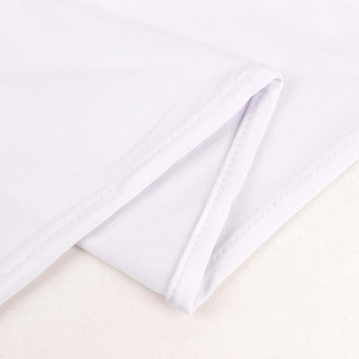 Close-up of folded white fabric showing smooth texture and clean stitching.