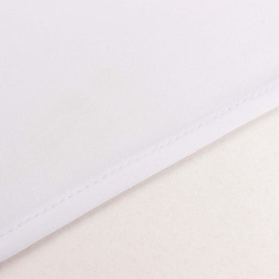 Close-up of white fabric texture with visible stitching details.