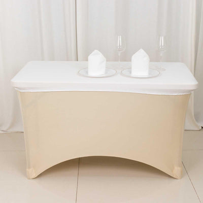 Elegant table setting with white tablecloth and glassware.