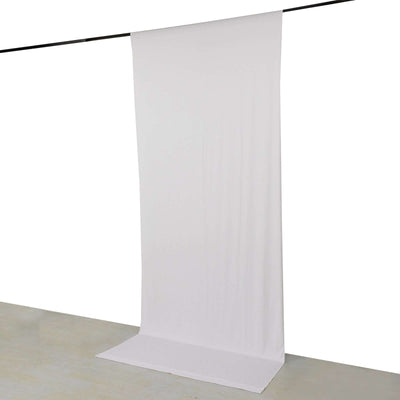 White backdrop fabric on a hanging rod for photography.