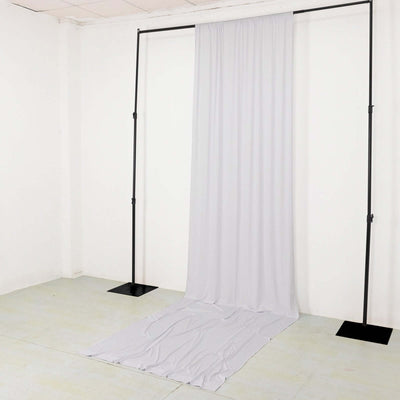 Gray backdrop draped on a support frame for photography use.