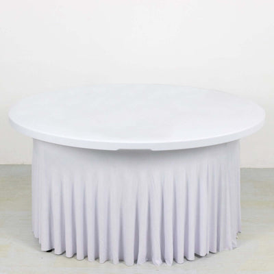 Round white table with a pleated tablecloth on a plain background.