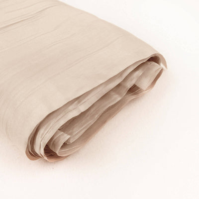 Beige fabric roll on a light background.
