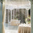 Elegant event decor with sparkling lights and floral arrangements.