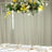Elegant floral arch centerpiece with yellow and white flowers for event decor.
